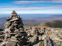 Rock cairns line the Appalachian trail at the summit of Mt Washington.